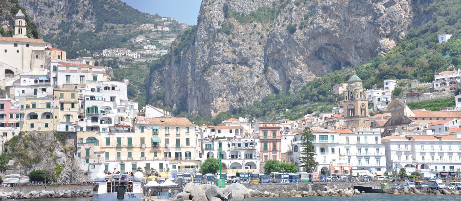 Amalfi waterfront, cathedral and hillside buildings seen from the sea